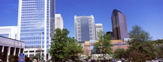 Downtown modern buildings in a city Charlotte Mecklenburg County North Carolina USA 2011 Canvas Art - Panoramic Images (30 x 12)