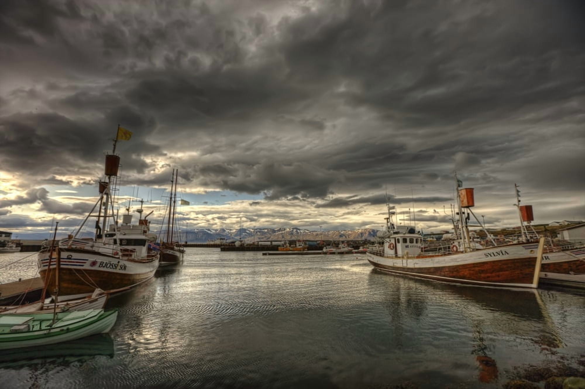 Dramatic Clouds Over Husavik Harbour Northern Iceland Canvas Art - Robert Postma Design Pics (17 x 11)