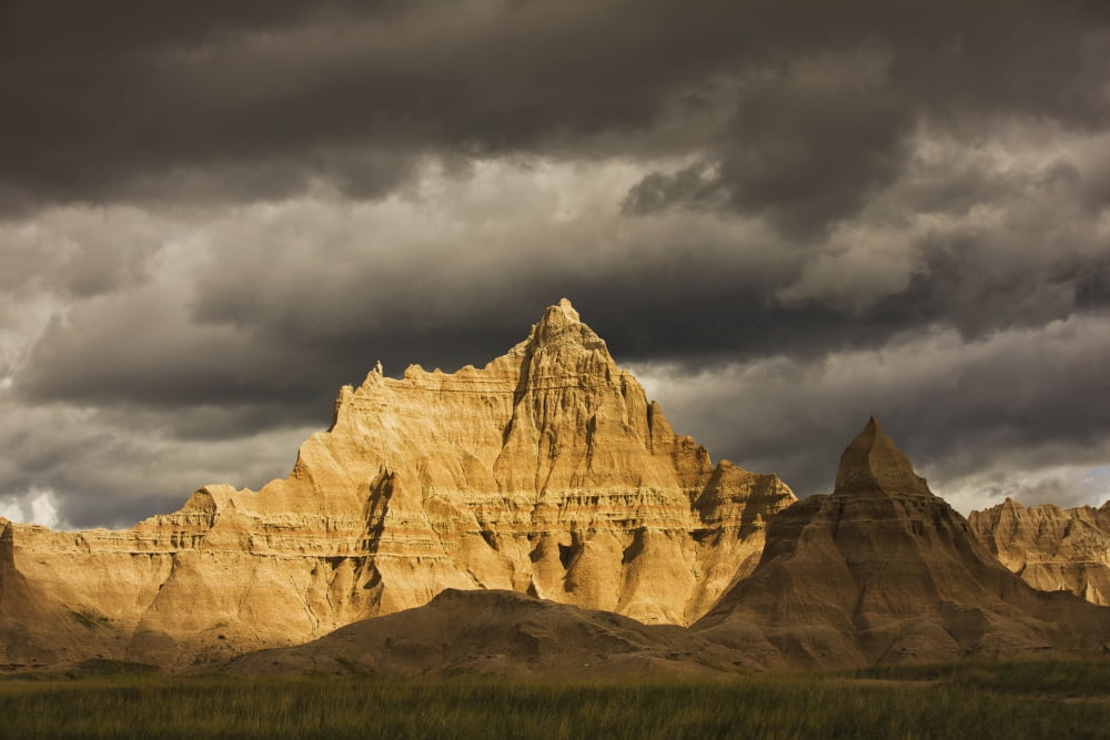 Dramatic light during a storm in badlands national park south dakota usa Canvas Art - Robert Postma Design Pics (38 x 24)