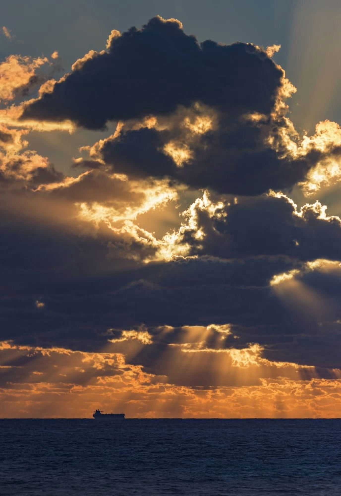 Dramatic sky with clouds glowing at sunset over the ocean and a ship in the distance Tarifa Cadiz Andalusia Spain Canvas Art - Ben Welsh Design Pics (12 x 18)