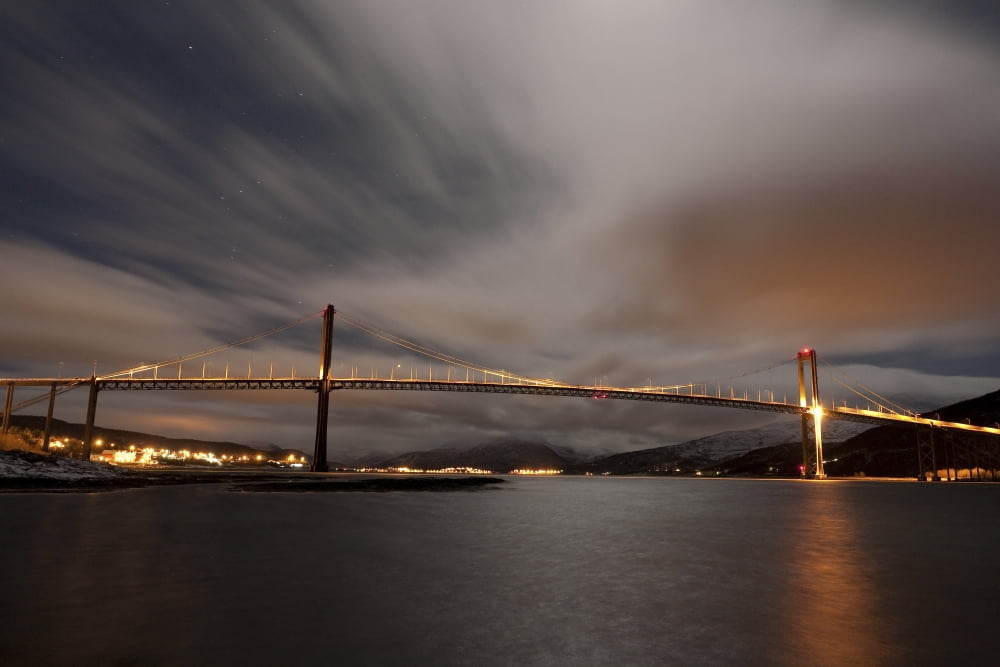 Dramatic sky over Tjeldsund Bridge in Troms County Norway Canvas Art - Arild HeitmannStocktrek Images (18 x 12)