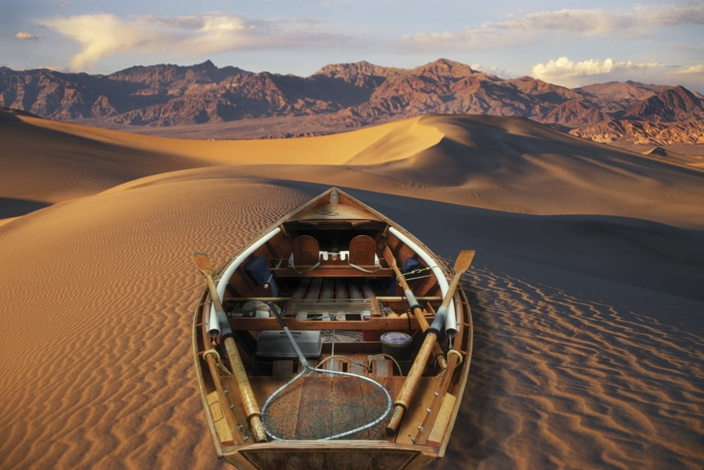 Drift Boat Resting On Sand Dunes In Death Valley National Park Representing Global Warming Digital Composite Canvas Art - Ron Sanford Design Pics (34 x 22)