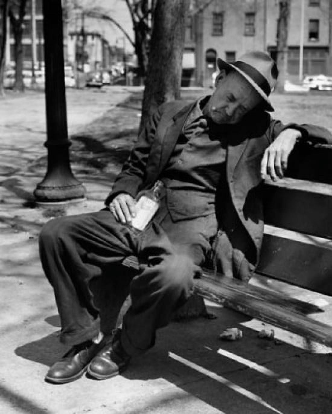 Drunk senior man sitting on a park bench Canvas Art - (24 x 36)