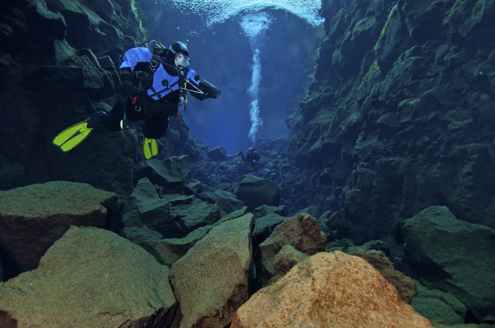 Dry suit divers in gin clear waters of Silfra Crack Iceland Canvas Art - Mathieu MeurStocktrek Images (18 x 12)