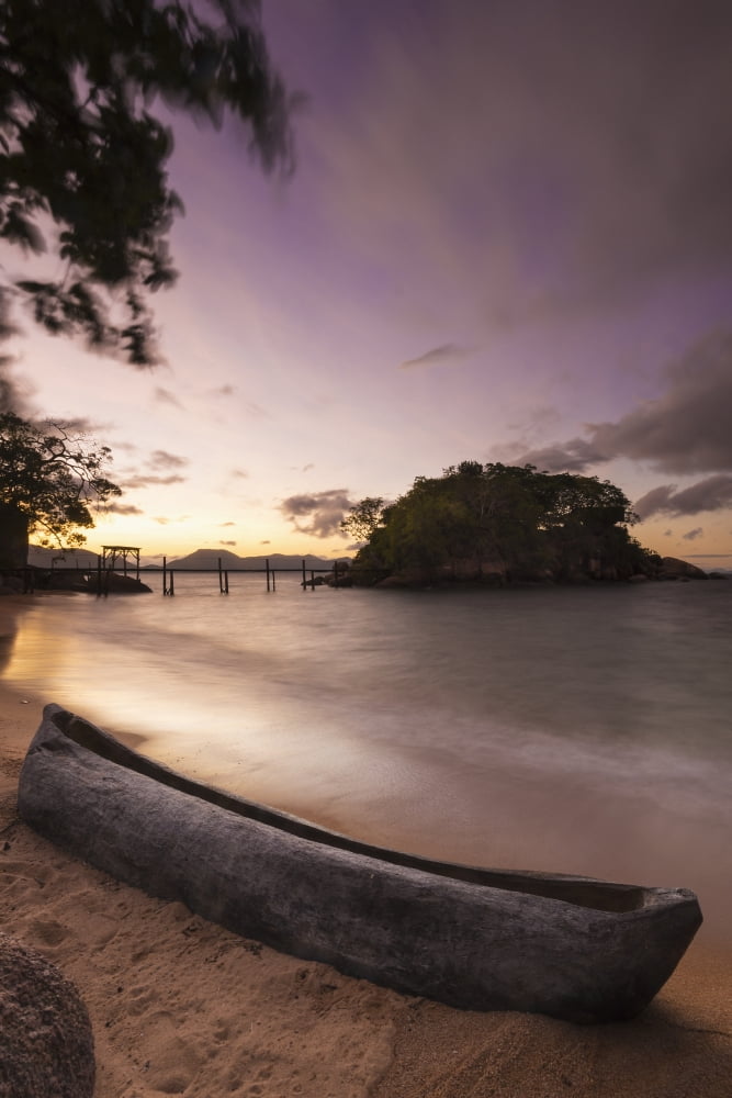 Dugout canoe on small beach on Mumbo Island Lake Malawi Malawi Canvas Art - Ian Cumming Design Pics (12 x 19)