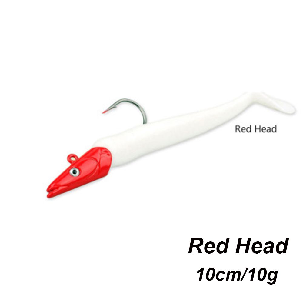 fish lures with red heads and wormlike tail Buggs Fishing Curl-Tail Redfish Jig (2nd Generation) Rigged with our 6 tails Mop Tail Jig Tying Instructional