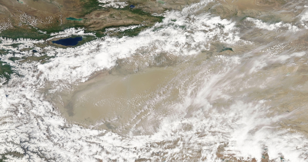 Dust and clouds hovered over the Taklimakan Desert Canvas Art - Stocktrek Images (38 x 20)
