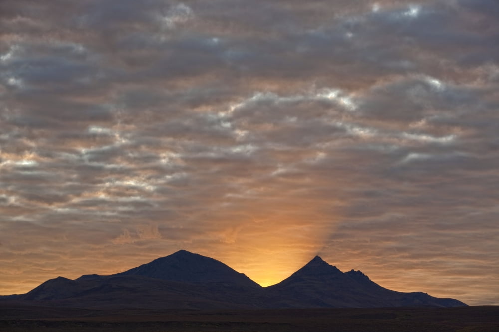 Early Morning Sunlight Shining From Behind A Mountain Along The Dempster Highway Yukon Canada Canvas Art - Robert Postma Design Pics (18 x 12)