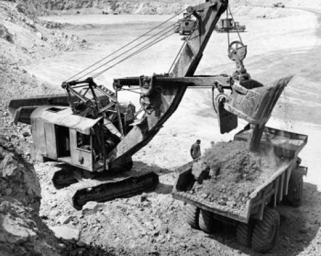Earth mover loading copper ore at an open pit mine in to a dump Nevada USA Canvas Art - (24 x 36)
