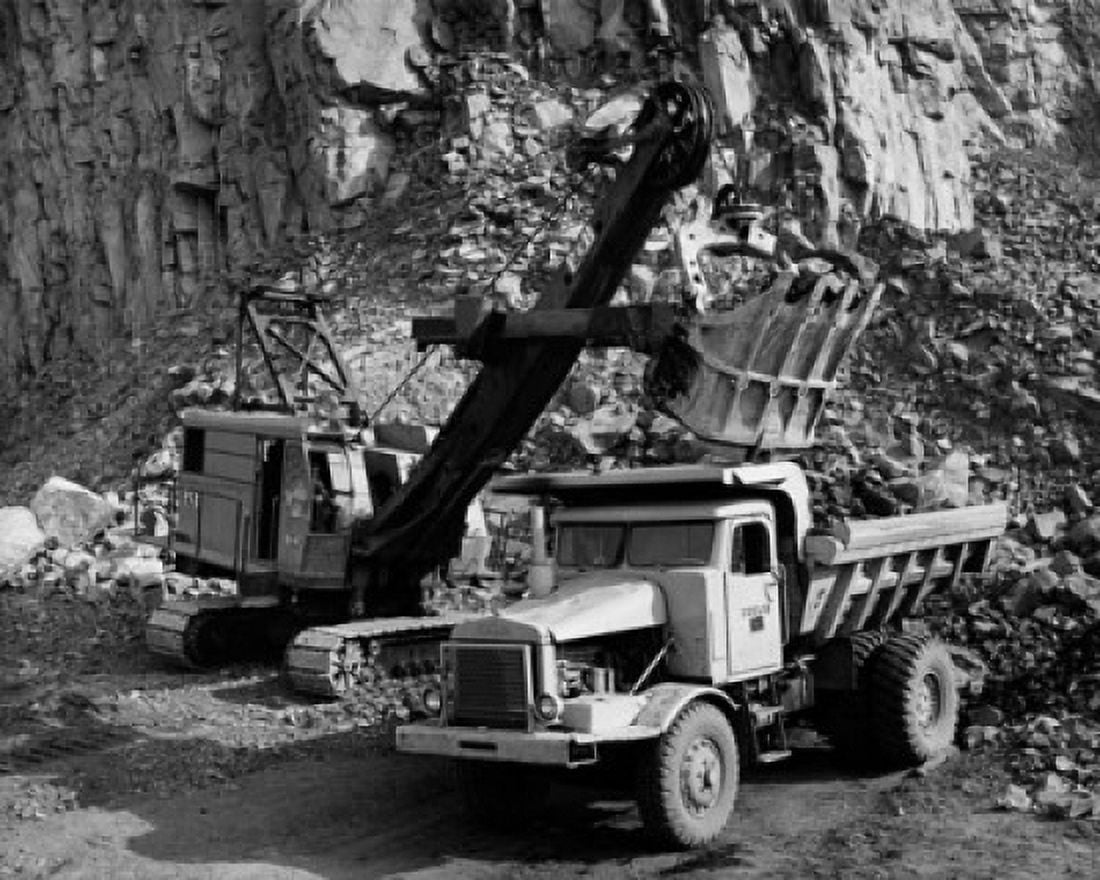 Earth mover loading rocks in to a dump truck Canvas Art - (18 x 24)