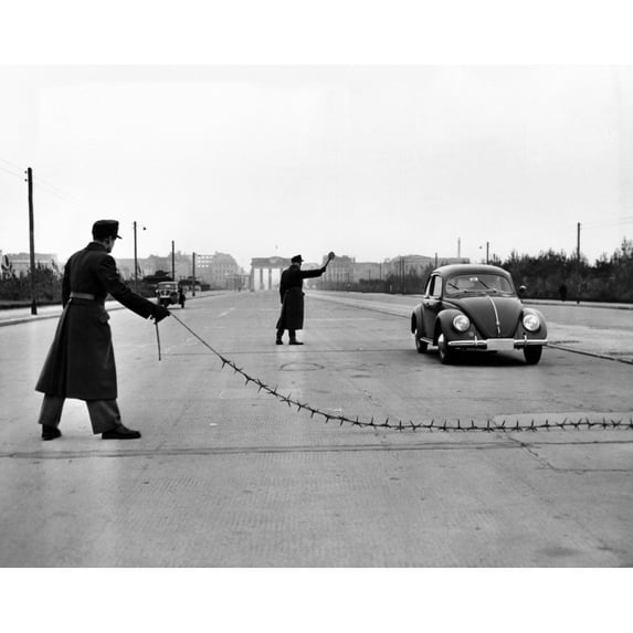 East Berlin Customs Police Stopping A Volkswagen On The Charlettenburger Chaussee With A Tire Puncturing Heavy Barbed