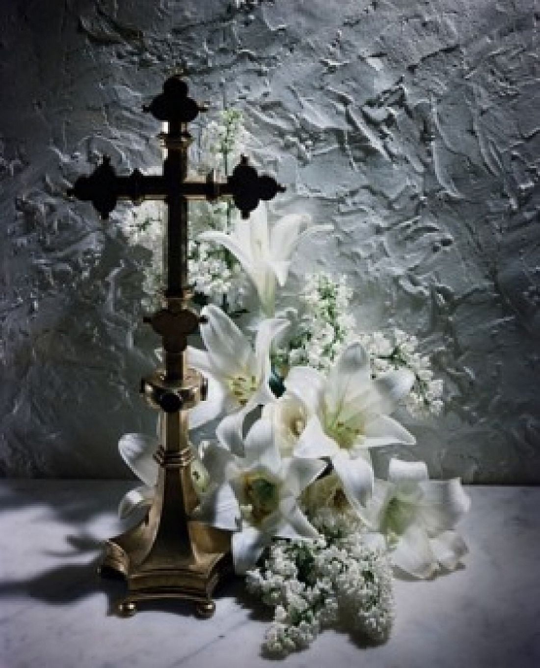 Easter Lily flowers near a crucifix Canvas Art - (24 x 36)