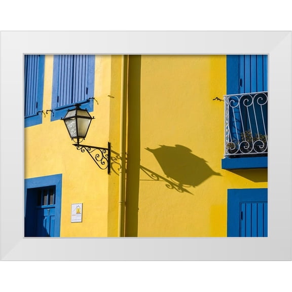 Eggers, Julie 14x12 White Modern Wood Framed Museum Art Print Titled - Portugal-Aveiro-Shadow of street lantern on colorful yellow building with bright blue shutters