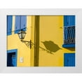 thumbnail image 1 of Eggers, Julie 18x15 White Modern Wood Framed Museum Art Print Titled - Portugal-Aveiro-Shadow of street lantern on colorful yellow building with bright blue shutters, 1 of 4