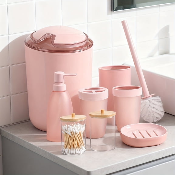 Eight-Piece Set of Pink Bathroom Items Including a Waste Bin, Toilet Brush, Toothbrush Holder, Lotion Dispenser, Soap Dish, Toothbrush Cup, And Q-Tip Holder