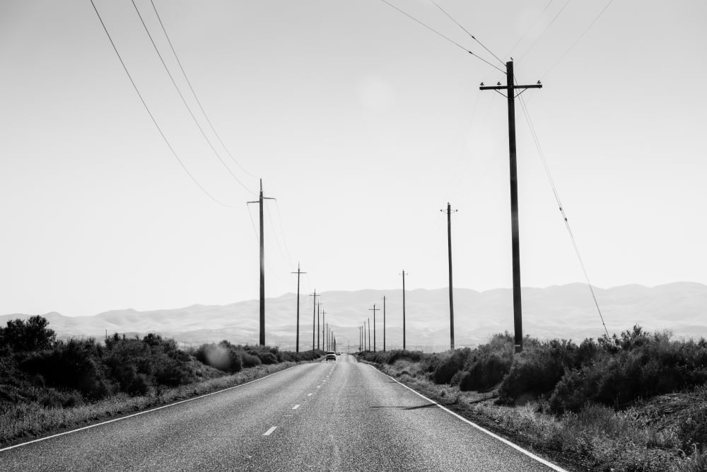 Electric poles on both sides of a road Bakersfield Kern County California USA Canvas Art - Panoramic Images (24 x 36)