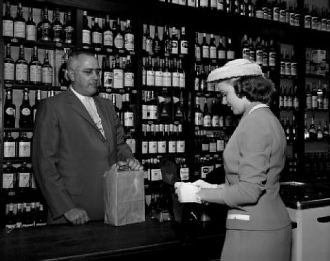 Elegance woman doing shopping in liquor store Canvas Art - (24 x 36)