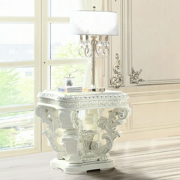 Elegant Antique White Pedestal Table With Ornate Floral Designs And Silver End Decorative Motifs Trim For All Settings