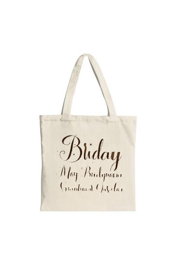 Elegant cream canvas tote bag with vintage script design: " Bidy " in large stylish font perfect for shopping travel and parties