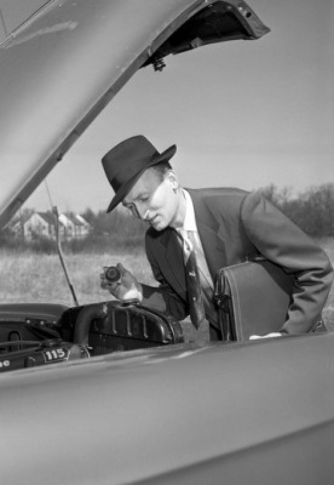 Elegant man checking engine of broken car Canvas Art - (18 x 24)