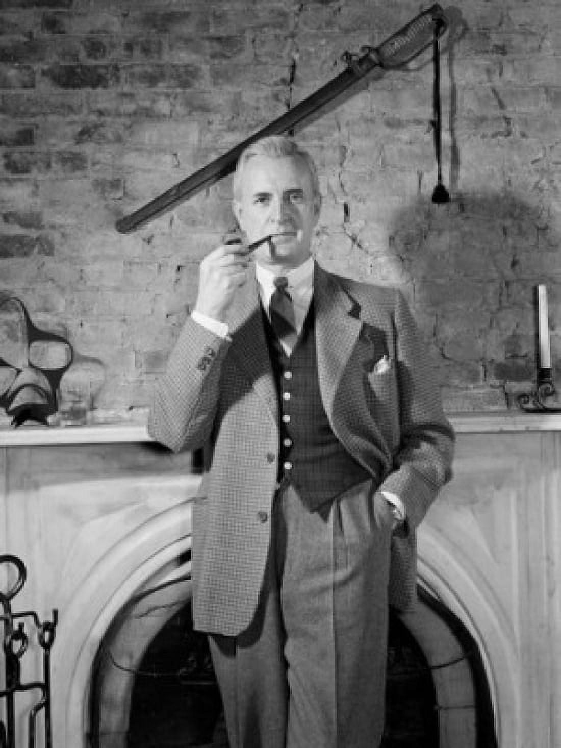 Elegant man standing by fireplace and smoking pipe Canvas Art - (24 x 36)