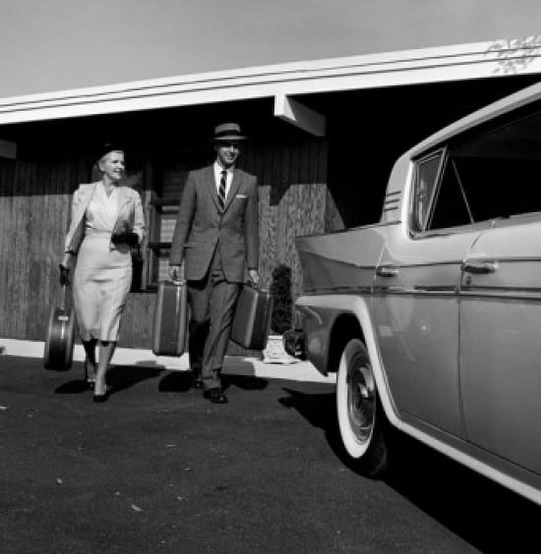 Elegant mid-adult couple walking with suitcases Canvas Art -  (18 x 24)