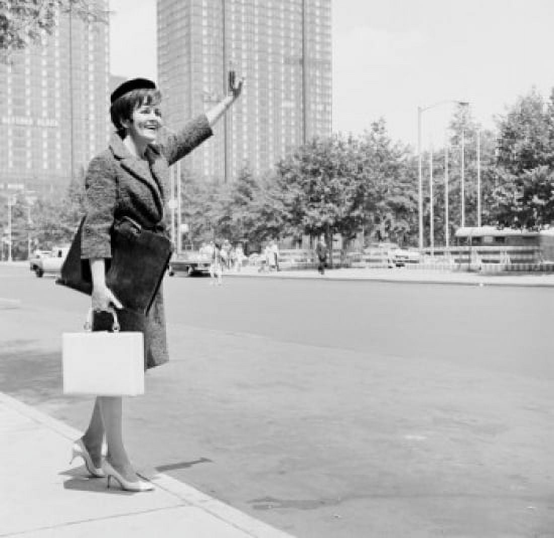 Elegant woman on street waving for taxi Canvas Art - (24 x 36)