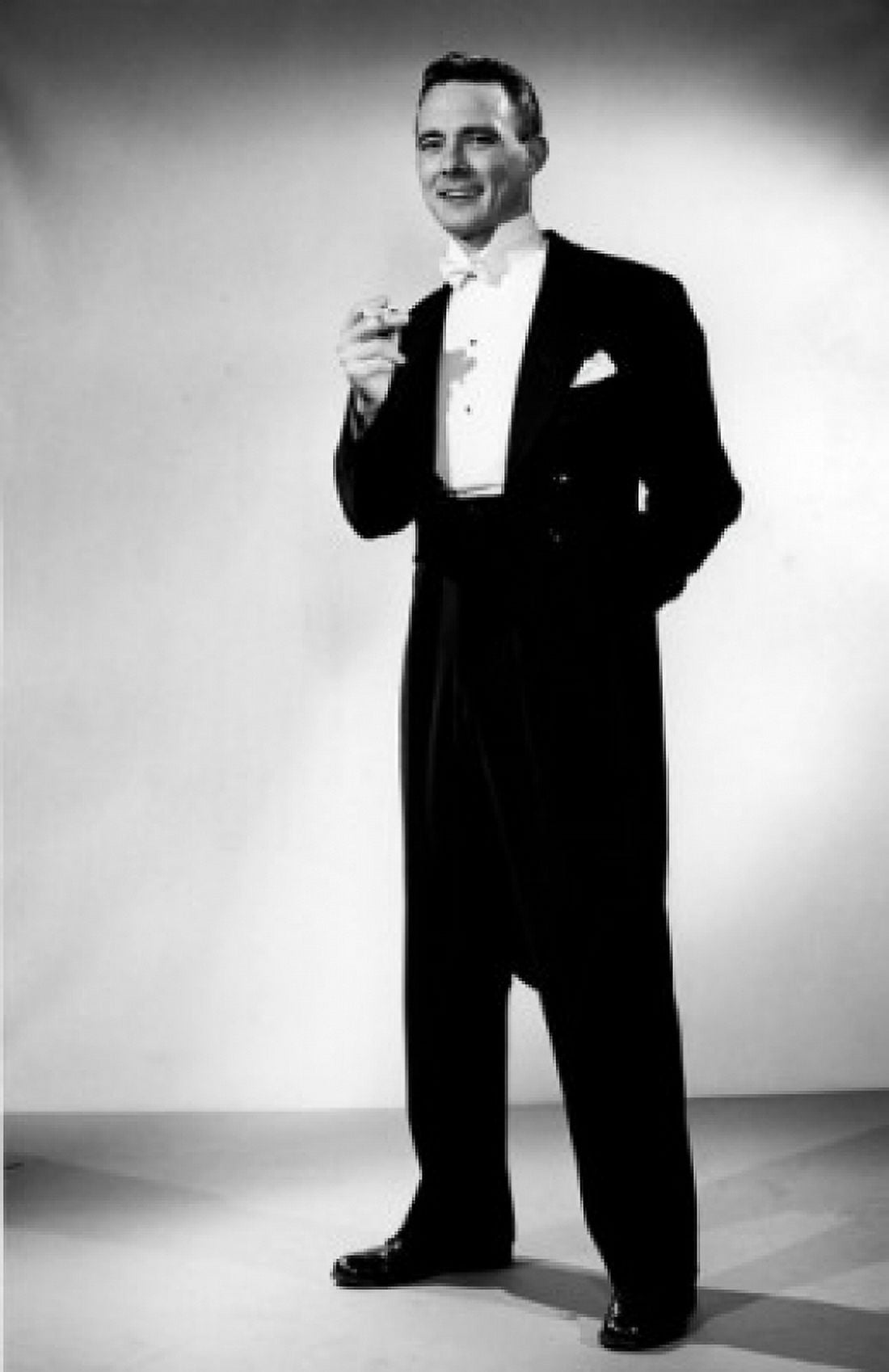 Elegant young man holding cigarette studio shot Canvas Art - (18 x 24)