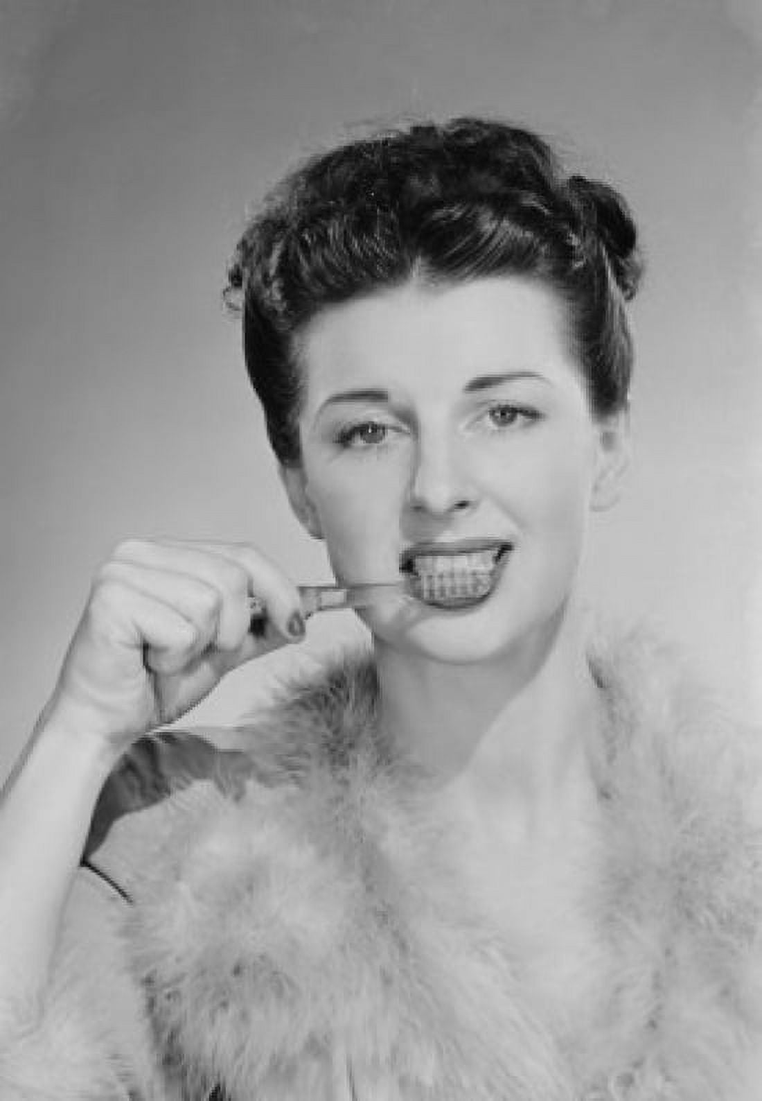 Elegant young woman brushing teeth Canvas Art - (24 x 36)