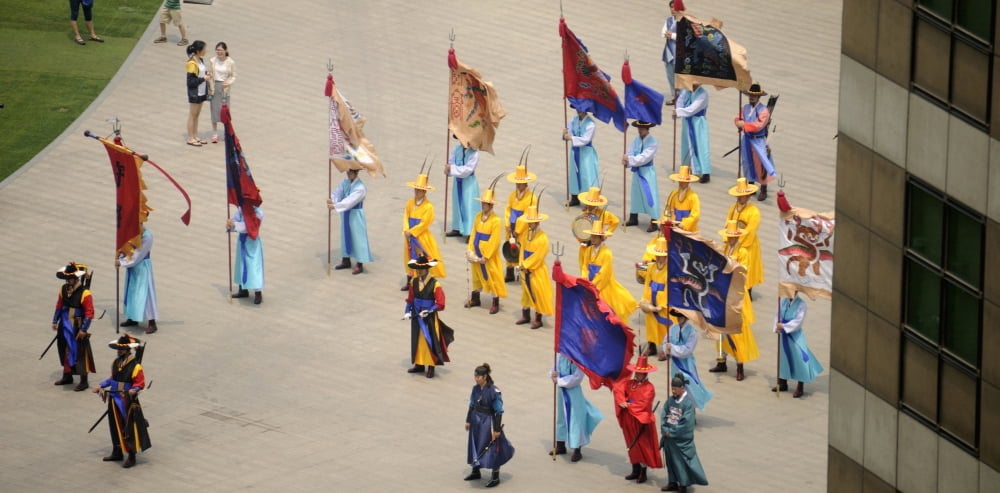 Elevated view of a procession in traditional garb at Seoul Plaza Seoul City Hall Seoul South Korea Canvas Art - Panoramic Images (36 x 12)