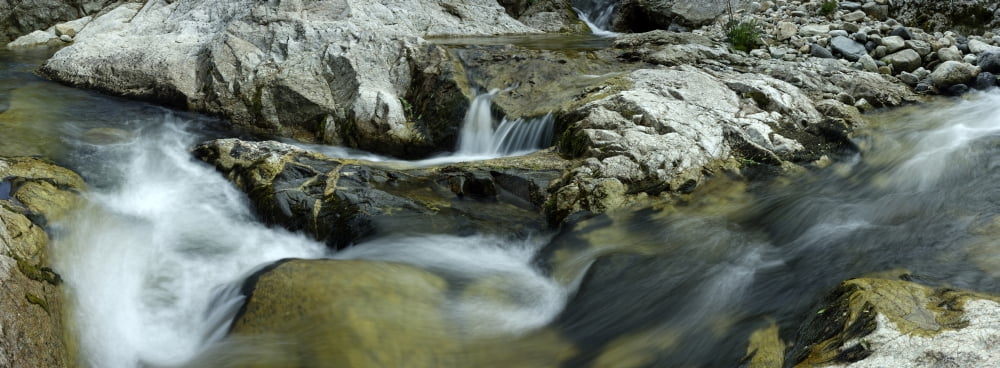 Elevated view of river passing through rocks Escoutay River Saint-Martial Ardeche Rhone-Alpes Massif Central France Canvas Art - Panoramic Images (7 x 18)