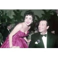 thumbnail image 1 of Elizabeth Taylor and Robert Taylor in low cut red dress candid circa 1950 24x36 Poster, 1 of 1
