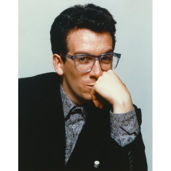 Elvis Costello Leaning Chin On Hand in Black Tuxedo Photo Print (24 x 30)