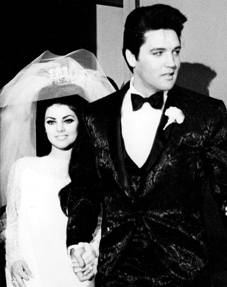 Elvis and Priscilla Presley at their wedding Photo Print (8 x 10