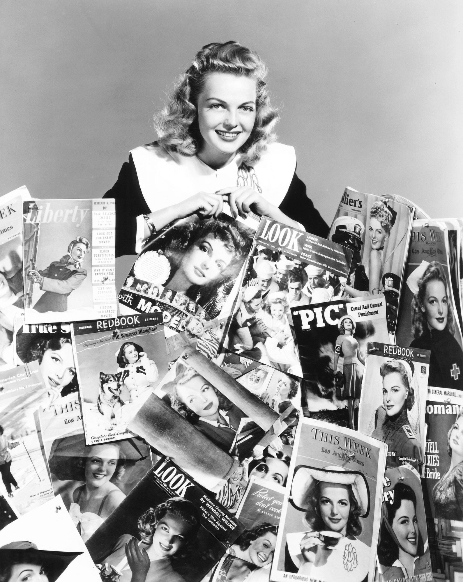 Elyse Knox Posing Amid All Of The Magazines Which Feature Her Picture On The Cover Canvas Art - (16 x 20)