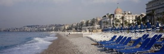 Empty lounge chairs on the beach Nice French Riviera France Canvas Art - Panoramic Images (36 x 12)