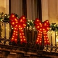 thumbnail image 1 of Energy LED Hanging Bow, Outdoor Lighted Bow Decoration for Festive Holiday Hanging Display on Porches, Weather Resistant Long Lasting Lights, 16x23in, Red, 1 of 8