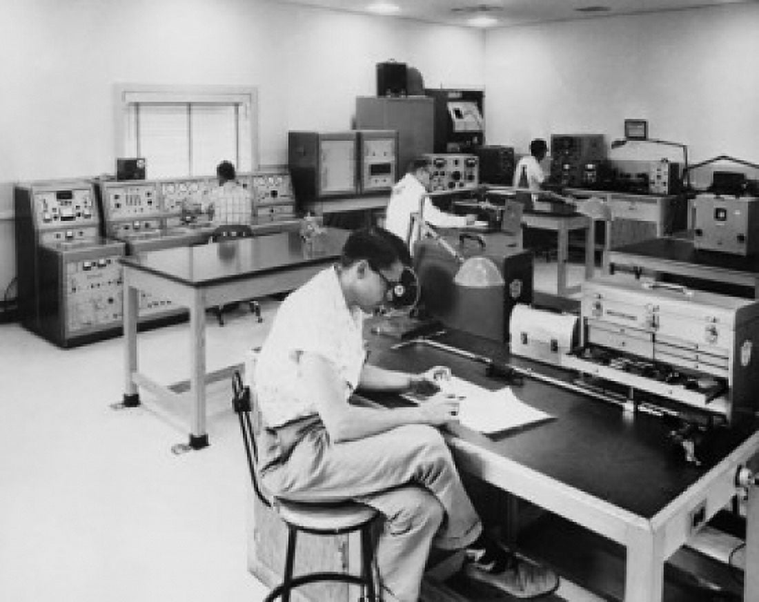 Engineers evaluating transmission systems components of a Boeing aircraft Canvas Art - (18 x 24)