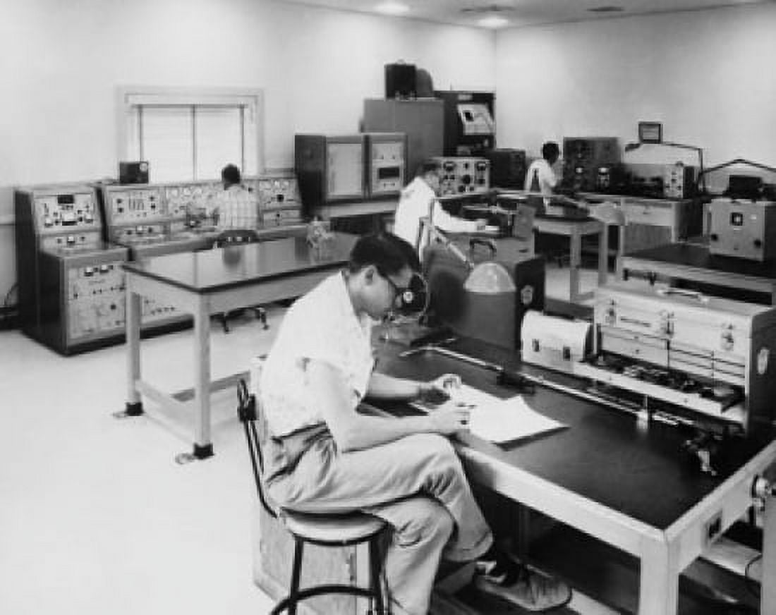 Engineers evaluating transmission systems components of a Boeing aircraft Canvas Art - (24 x 36)