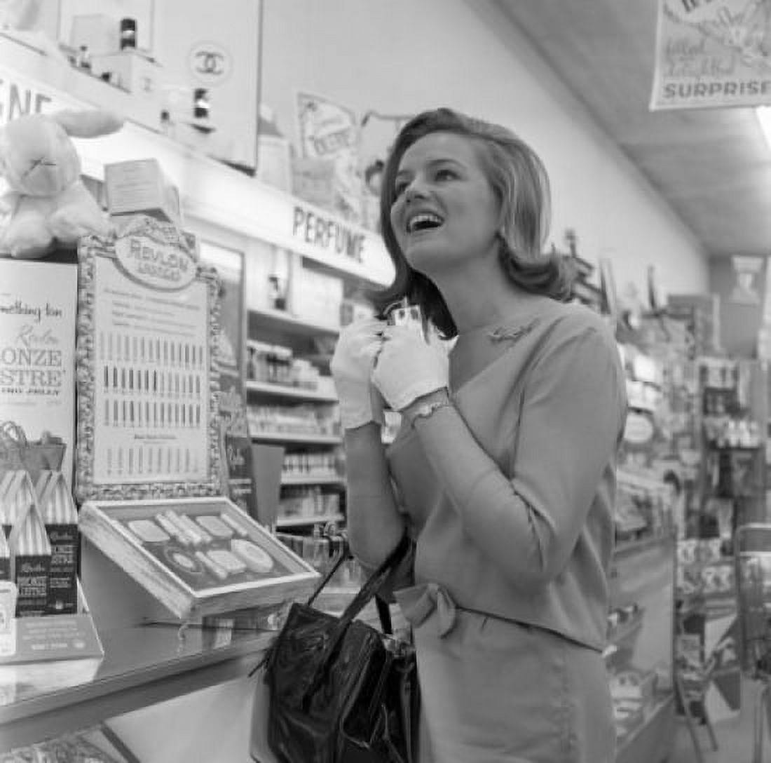 Enthusiastic young woman at cosmetics stand in supermarket Canvas Art -  (18 x 24)