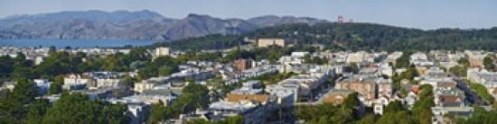 Entrance to San Francisco Harbor Golden Gate Bridge Towers visible above the Presidio San Francisco California USA Canvas Art - Panoramic Images (40 x 10)