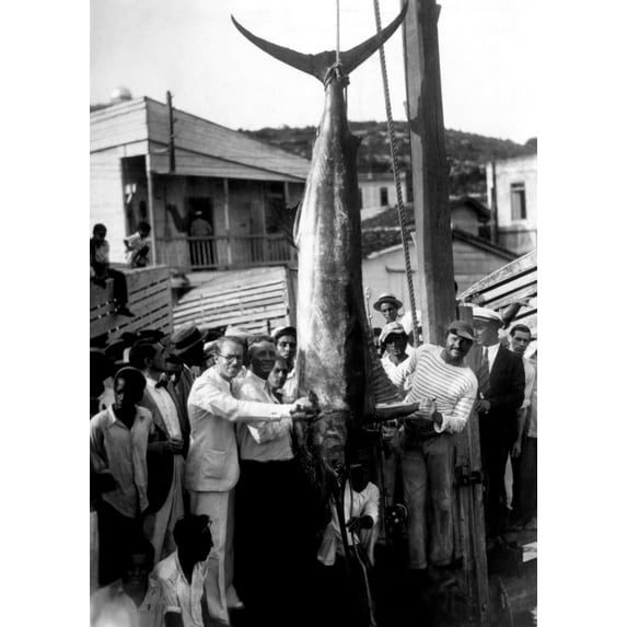 Ernest Hemingway With A Record Breaking Black-Marlin Caught On A Recent Fishing Trip Off The Cuban Coast Ca.