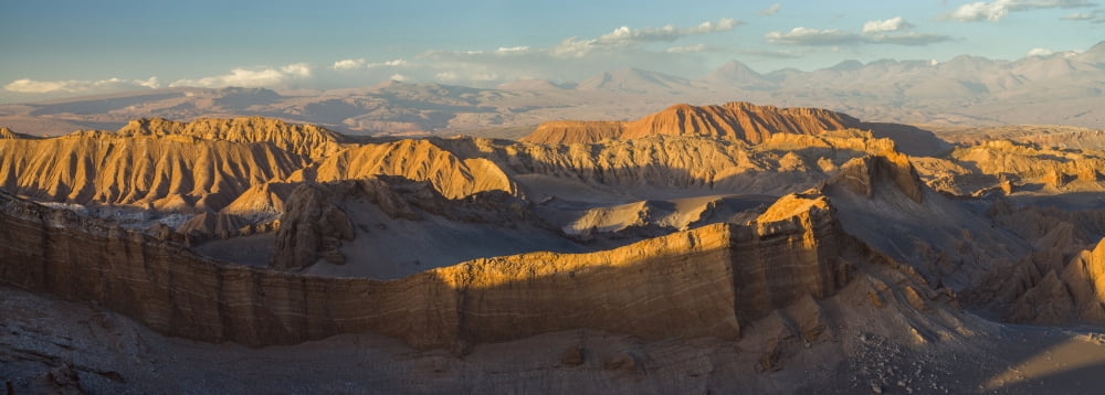 Eroded hills at sunset in the Atacama Desert Valle de la Luna Los Flamencos National Reserve near San Pedro de Atacama Antofagasta Region Chile Canvas Art - Panoramic Images (27 x 9)