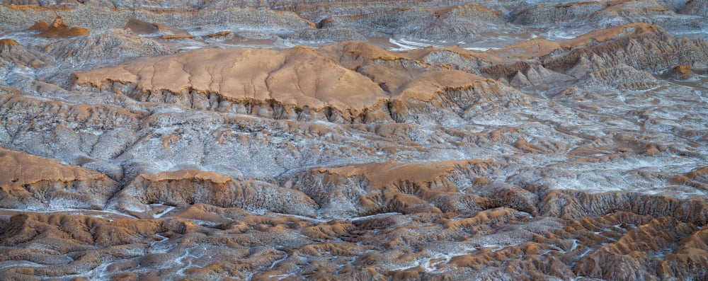 Eroded hills at sunset in the Atacama Desert Valle de la Luna Los Flamencos National Reserve near San Pedro de Atacama Antofagasta Region Chile Canvas Art - Panoramic Images (36 x 12)