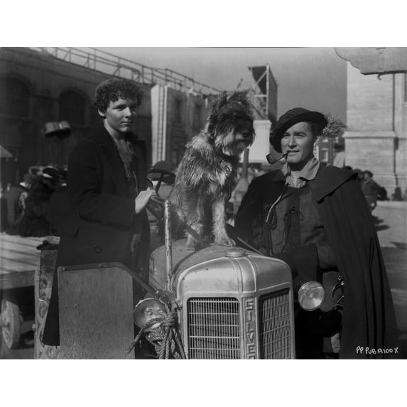 Errol Flynn on a Pipe with a Man and Dog Photo Print (8 x 10)