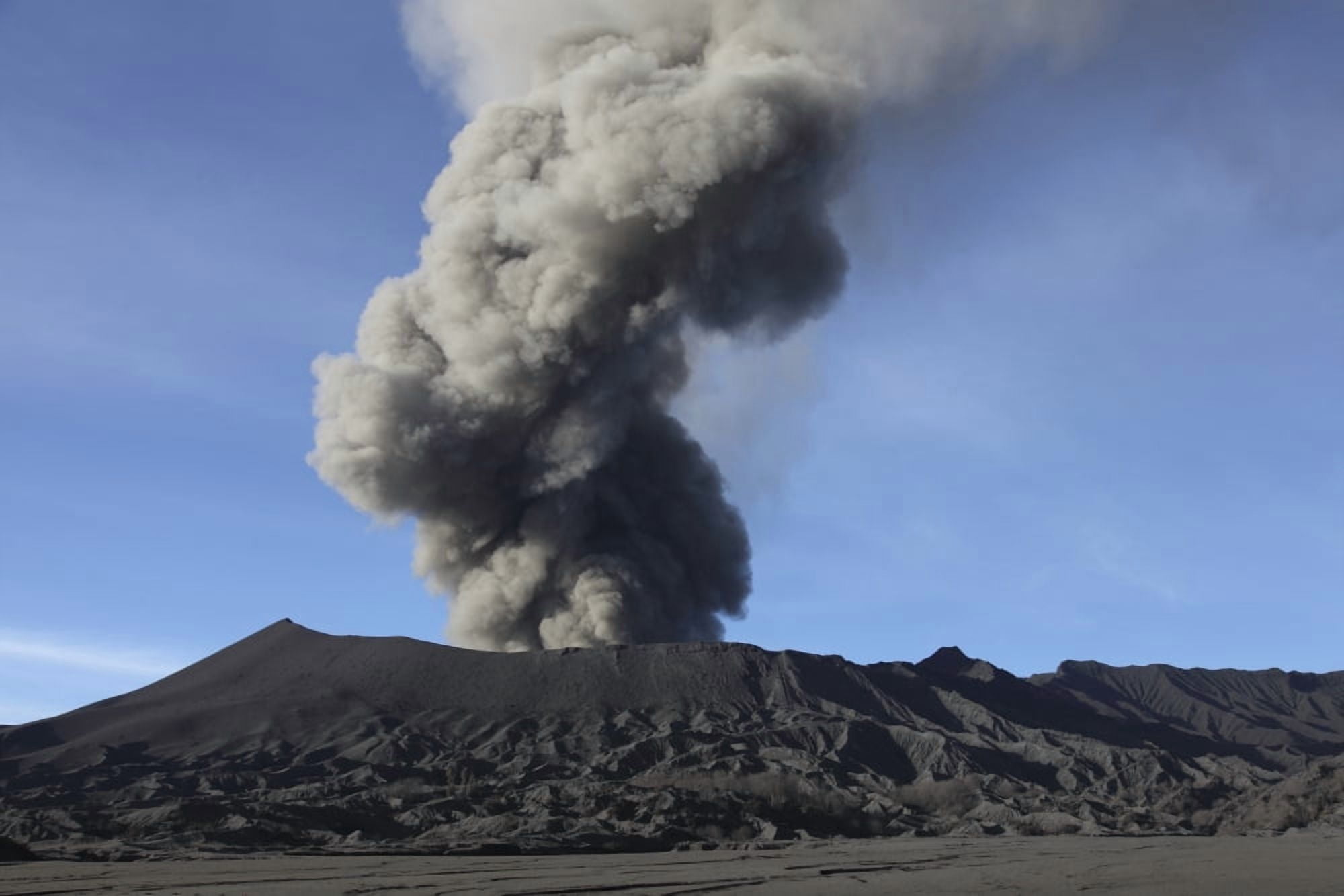 Eruption of ash cloud from Mount Bromo volcano Tengger Caldera Java Indonesia Canvas Art - Richard RoscoeStocktrek Images (18 x 12)