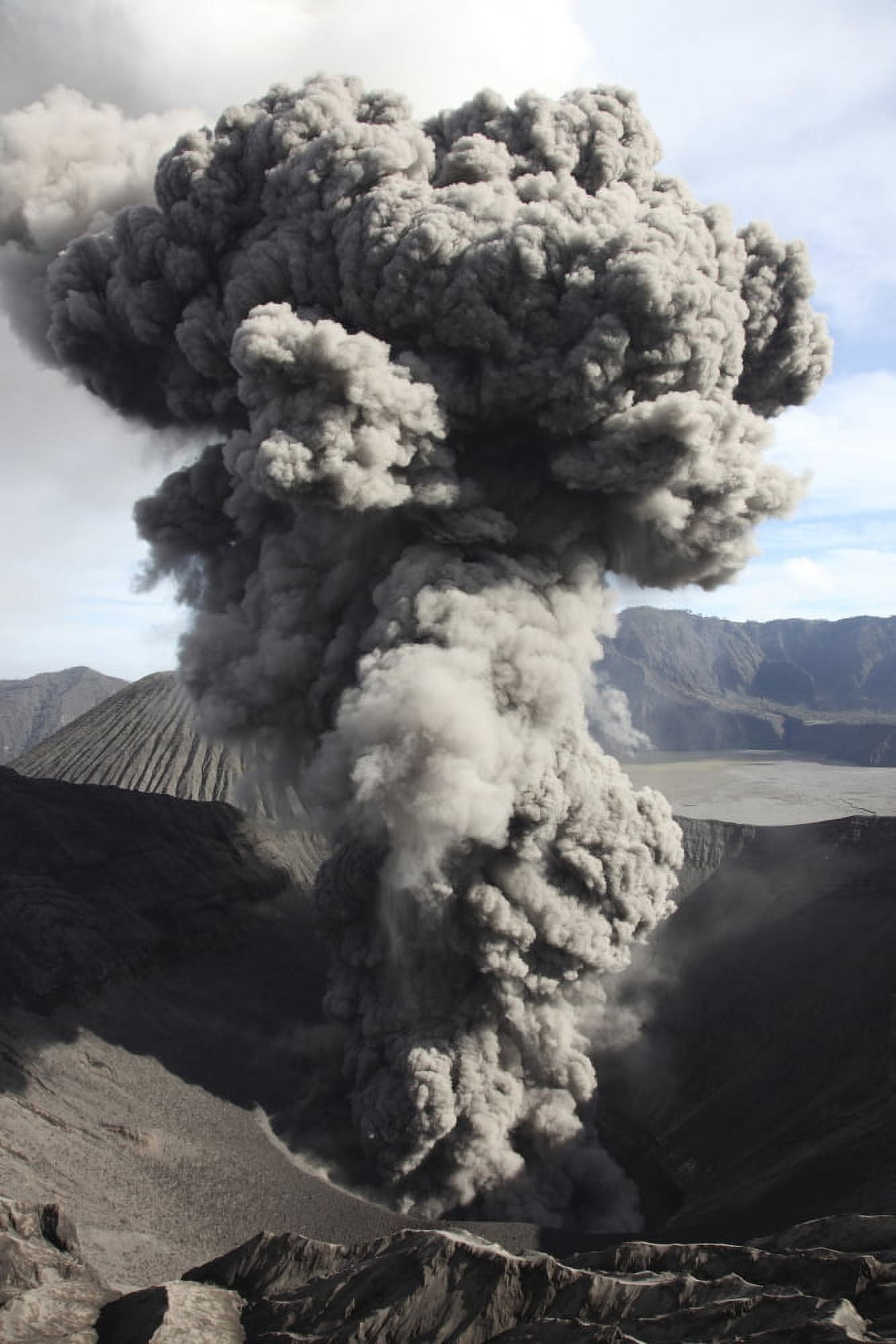 Eruption of ash cloud from crater of Mount Bromo Tengger Caldera Java Indonesia Canvas Art - Richard RoscoeStocktrek Images (23 x 35)