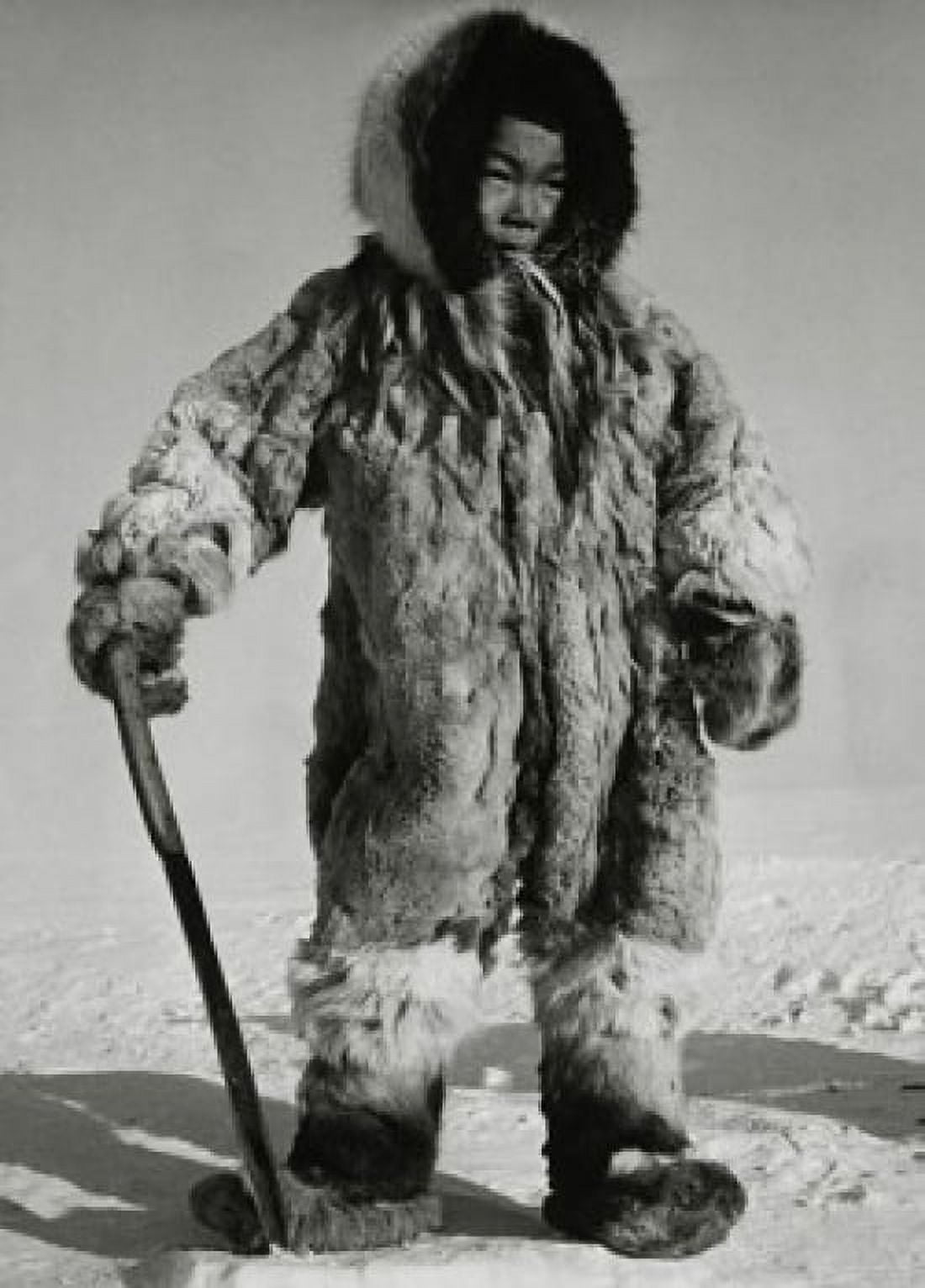 Eskimo boy standing on ice and holding a knife Canvas Art - (24 x 36)