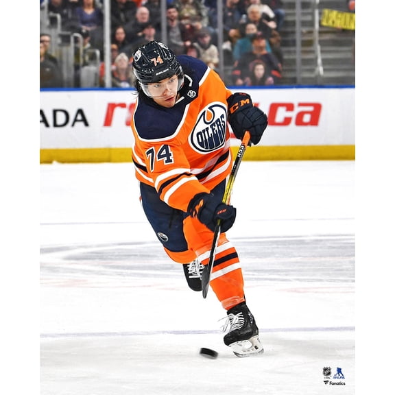 Ethan Bear Edmonton Oilers Unsigned Orange Jersey Shooting Photograph