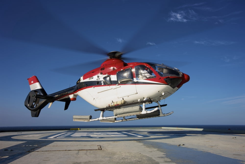 Eurocopter EC135 utility helicopter on the helipad of an oil rig Canvas Art - Terry MooreStocktrek Images (18 x 12)